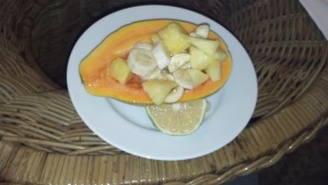 Papaya Halves filled with Pineapple and Banana slices.